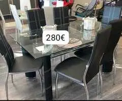 mesa moderna de cristal y seis sillas polipiel